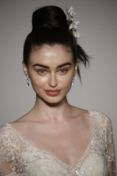 simple wedding hairstyles: model with sleek updo on the runway