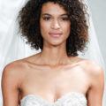 model on the bridal runway with curly twist out hairstyle with viel