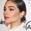 prom updos: model olivia culpo with shiny glossy dark hair with a side parting and low bun