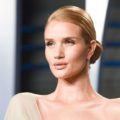 prom updos: model rosie huntington-whiteley on the red carpet with a sleek side bun hairstyle