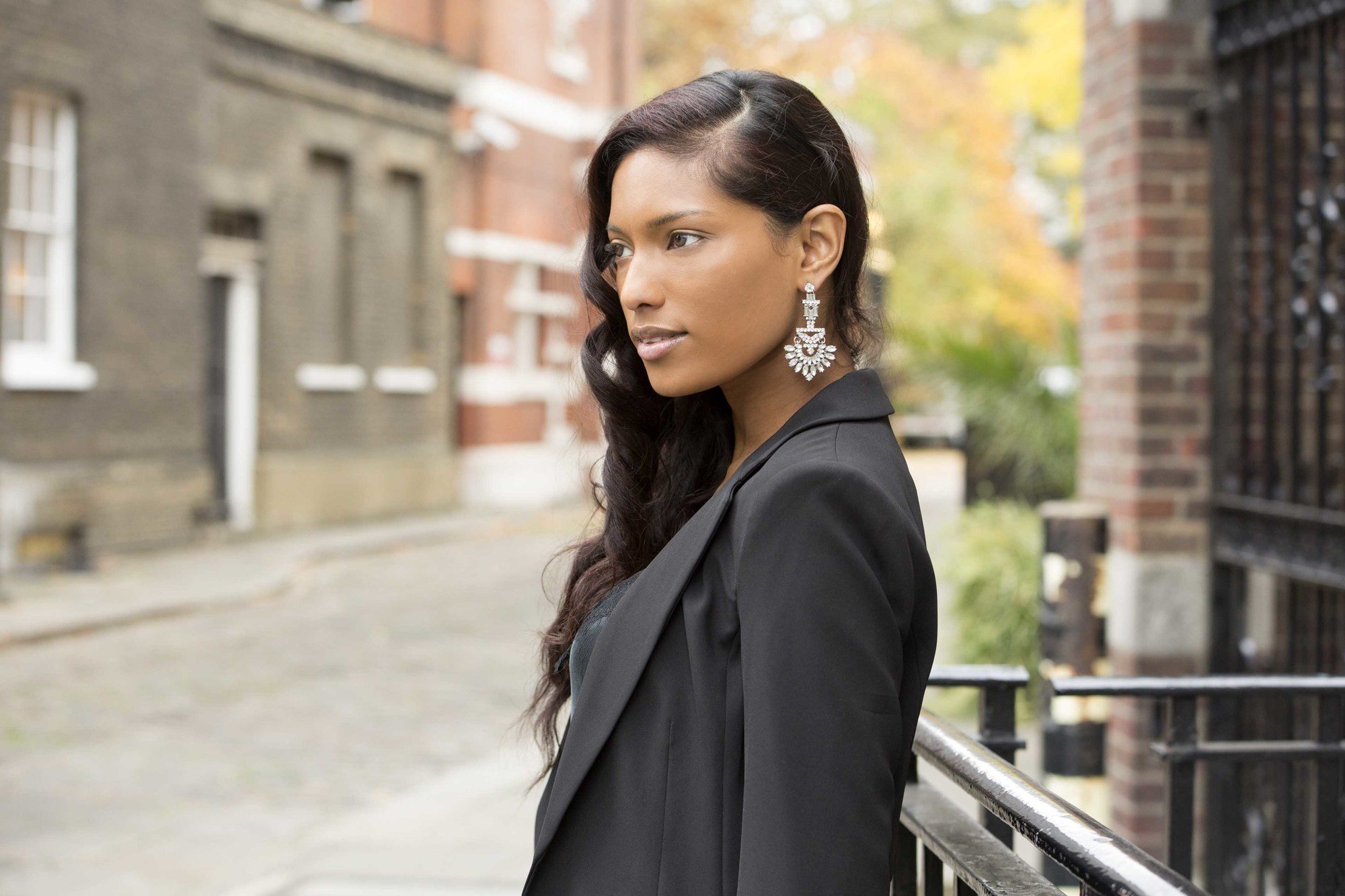 asian model with long dark hair styled to the side in old hollywood waves