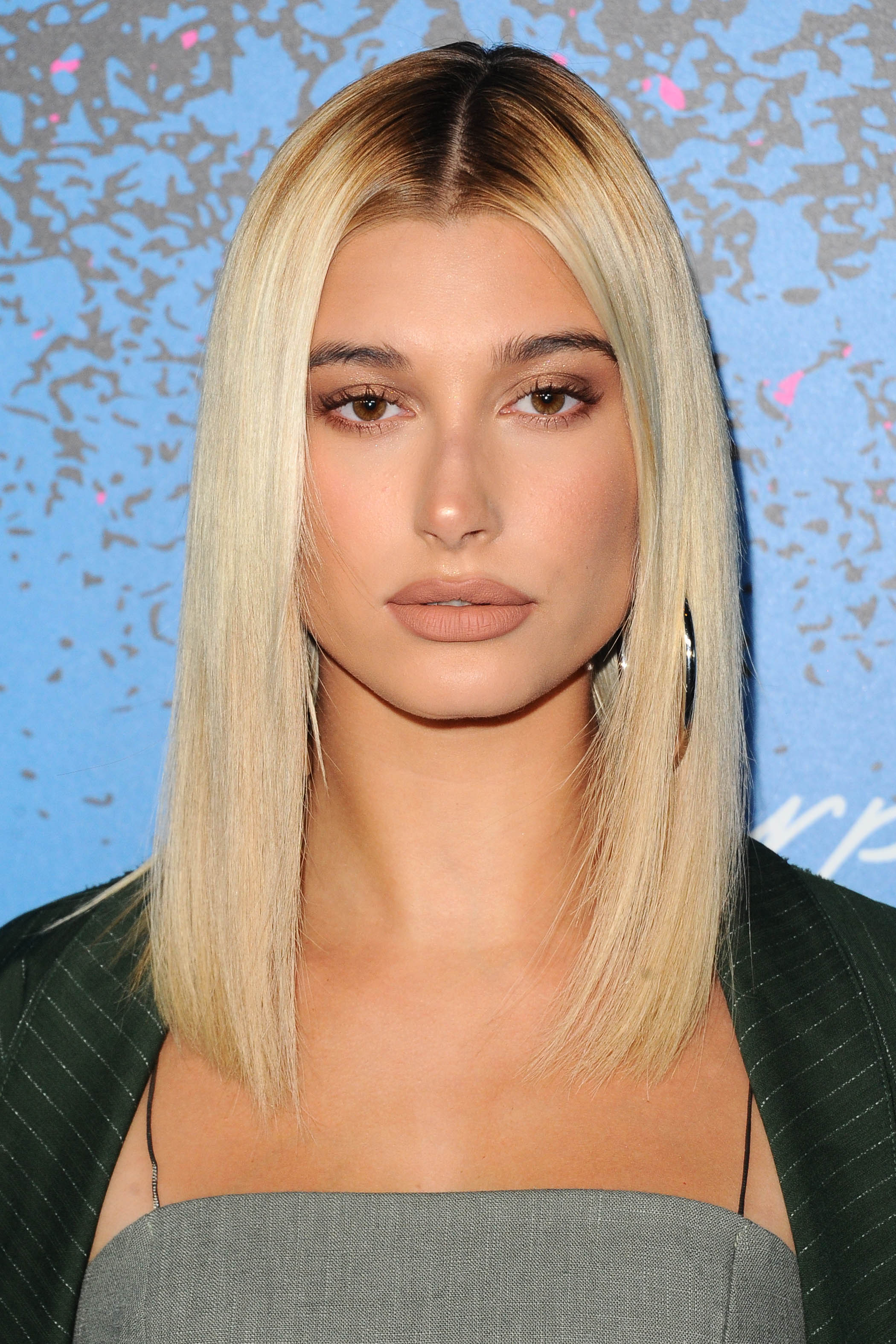 medium bob haircuts: shot of hailey baldwin with sleek hairstyle on the red carpet