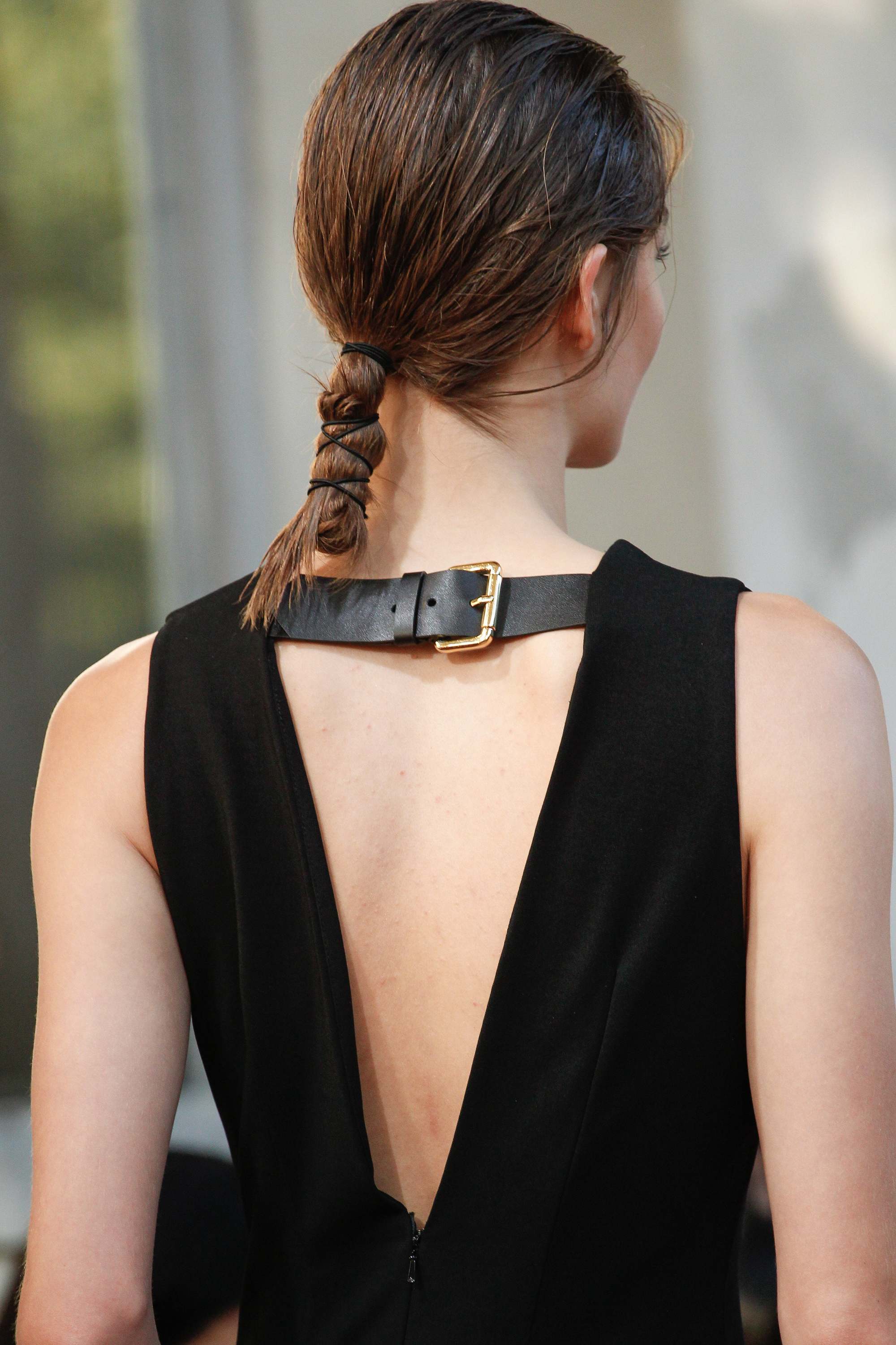 backshot of model with wrapped up textured ponytail