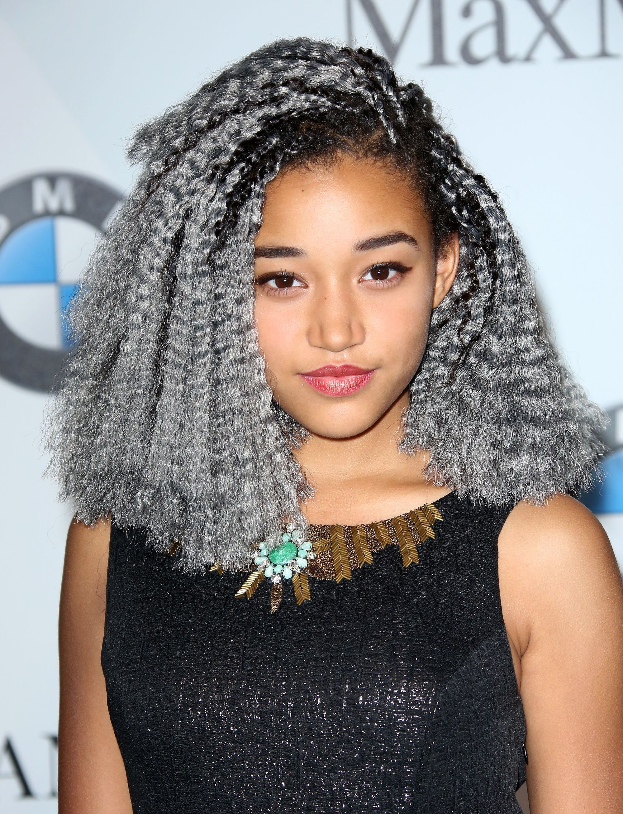 close up shot of amandla stenberg with silver grey hair crochet hairstyle