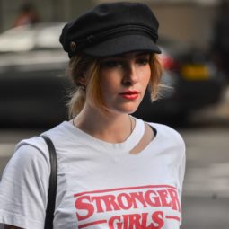 london fashion week street style shot of a blogger wearing a black baker boy hat
