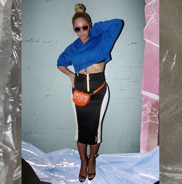front view of beyonce with blonde hair in sleek high topknot