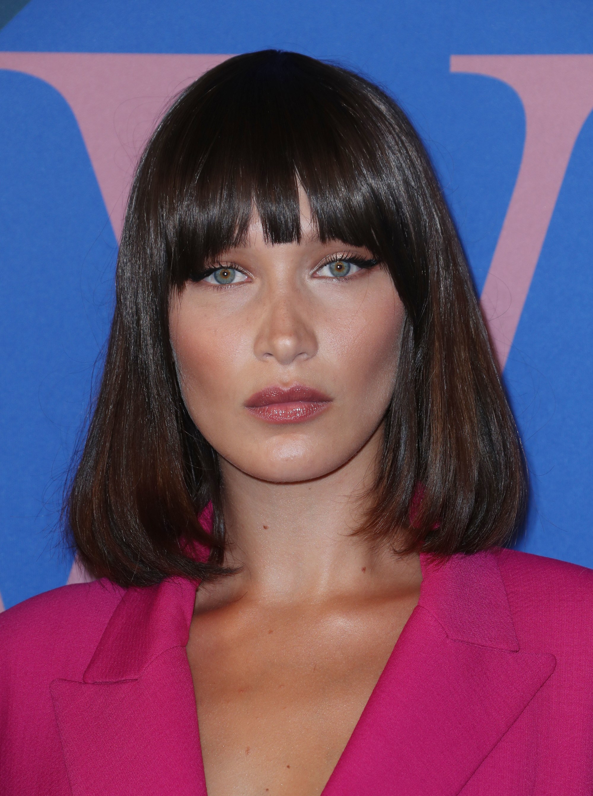 the best bangs directory: close up shot of bella hadid with blunt bangs hairstyle on the CFDA red carpet