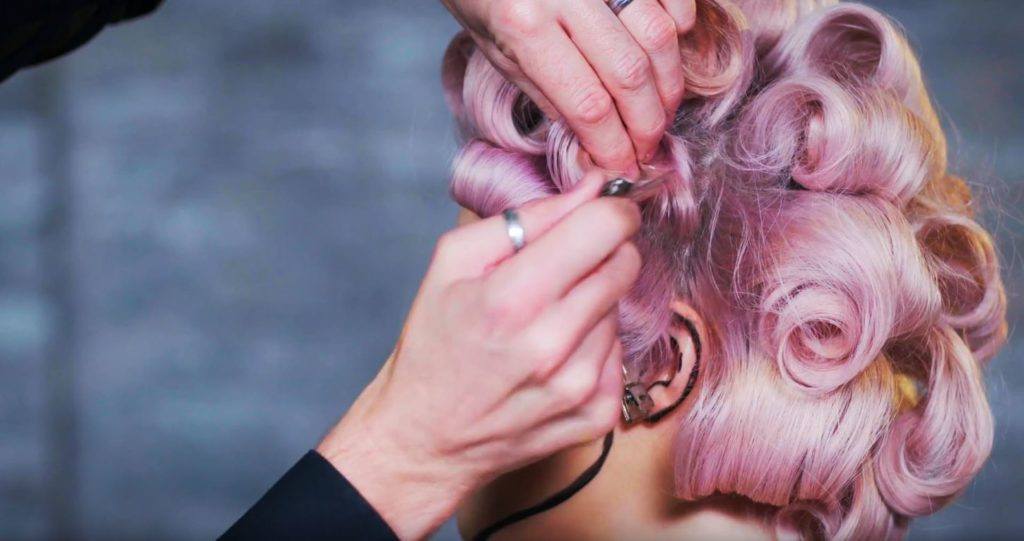 Superdrug Loves cartoon kid Halloween hair tutorial side view of pin curls being released
