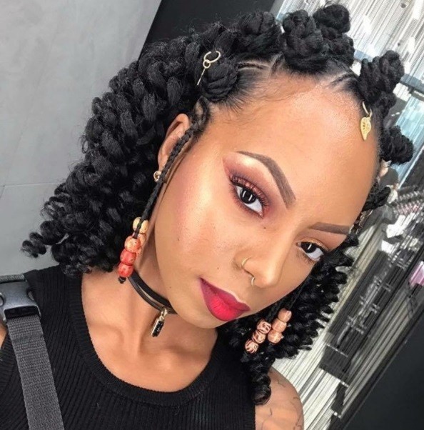bantu knots on weave: shot of woman with crochet weave styled into half up bantu knots style