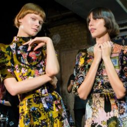 three models backstage at Erdem fashion show with different hair types and lengths
