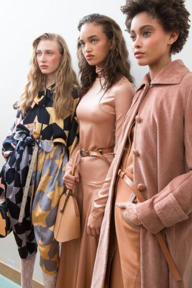 The lazy girl's guide to finding the best leave-in conditioner for dry hair: shot of three models backstage with three different hair types