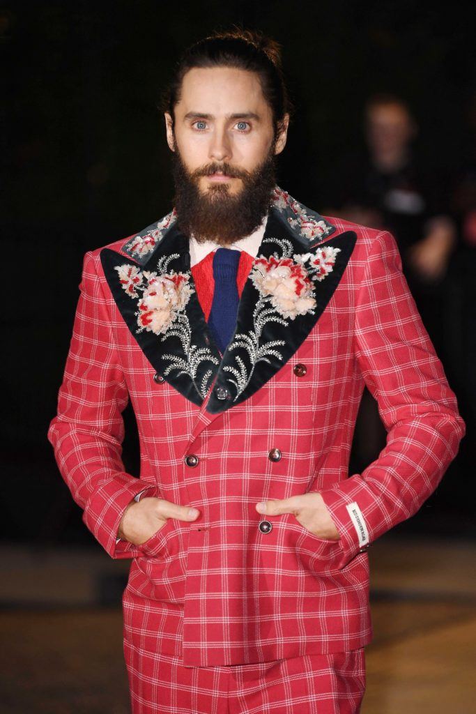 shot of jared with man bun hairstyle on the GQ Men of the Year Awards red carpet wearing red suit