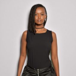 Kelela front row at PFWM's, with short locs and black outfit