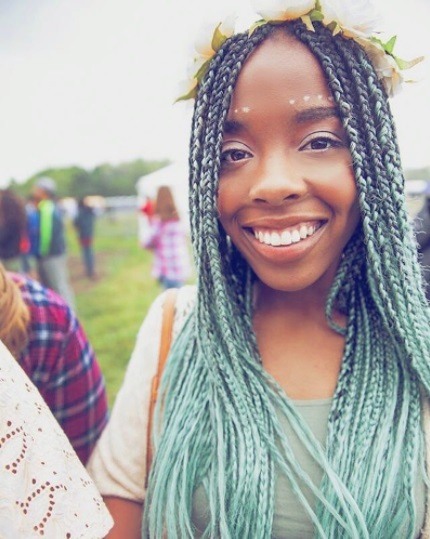 woman with ombre mint green seafoam box braids