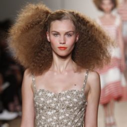 Marc Jacobs SS11 model with brown frizzy hair with side parting on catwalk