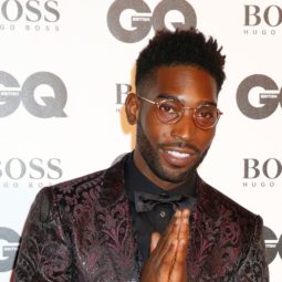 shot of tinie tempah on the GQ Men of the Year Awards red carpet wearing suit, with his hair styled into a high top fade