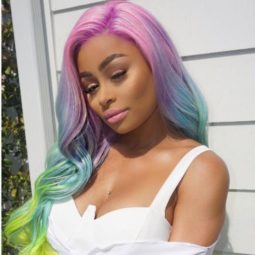 Blac Chyna with multi toned rainbow colour long hair with loose curls