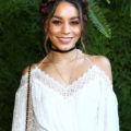 party braids inspiration: shot of vanessa hudgens with floral milkmaid braid wearing white and smiling