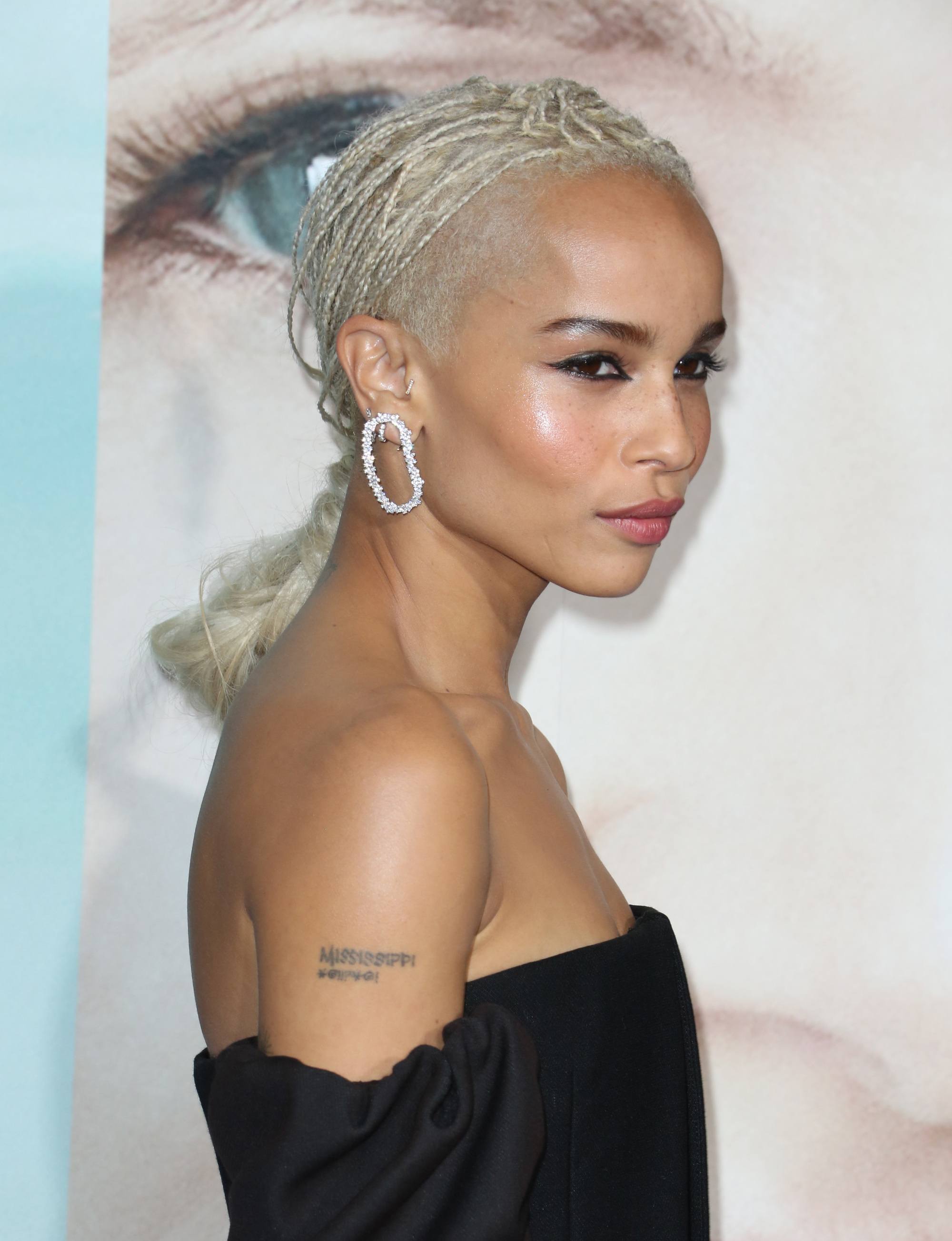 zoe kravitz with micro braids in a silver hair colour at a red carpet event