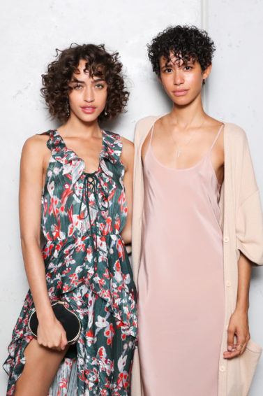type 3 hair guide: shot of two models with curly hair posing at the CFDA x Vogue Fashion fund event