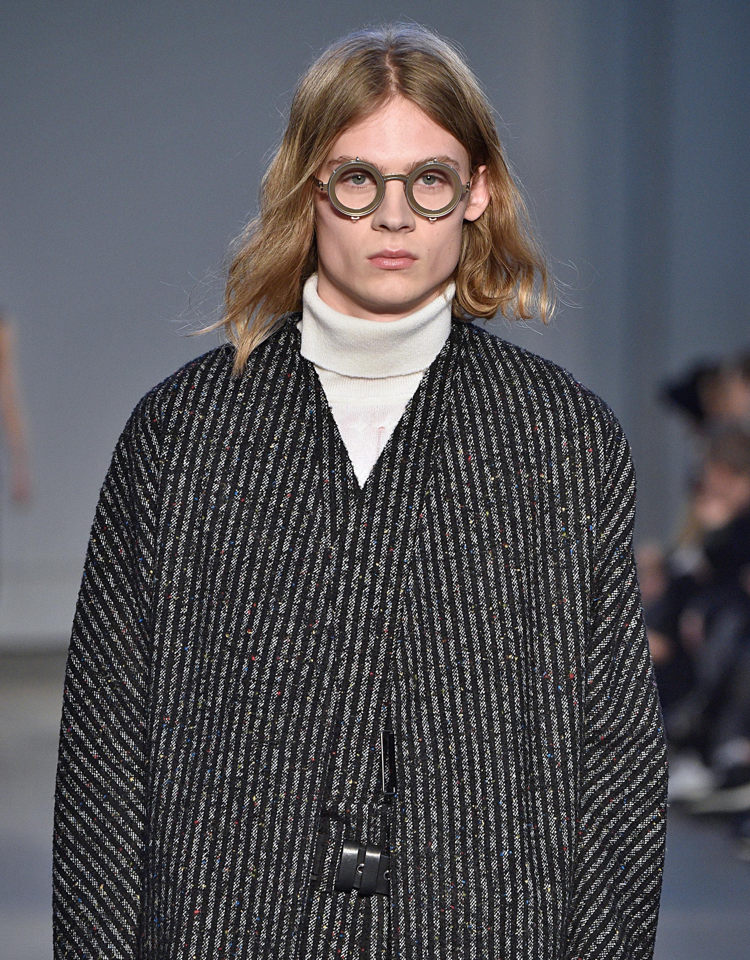 blonde male model with long flowing '90s kurt cobain hair