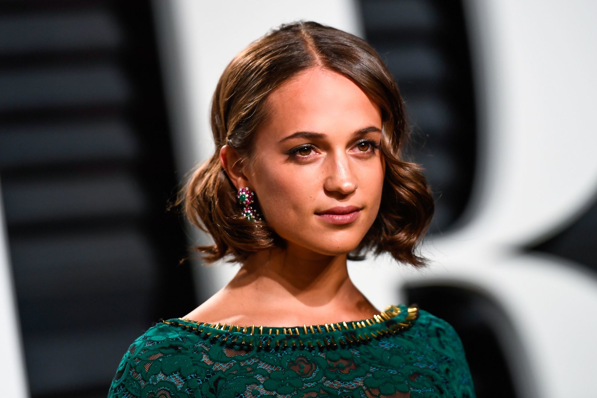 swedish actress alicia vikander at the vanity fair oscars party with a brunette bob haircut