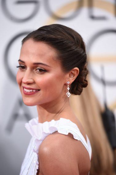 swedish actress alicia vikander at the 2016 golden globe awards with her dark hair in an updo