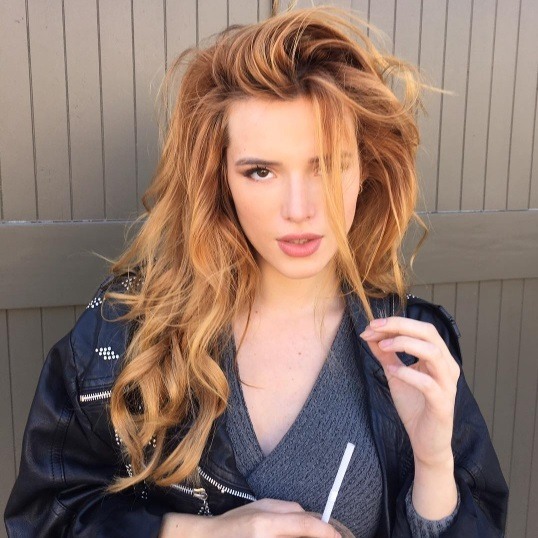 actress bella thorne with curly strawberry blonde hair