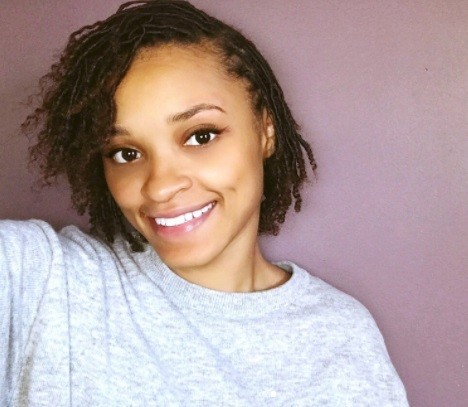 woman with short bob length faux locs