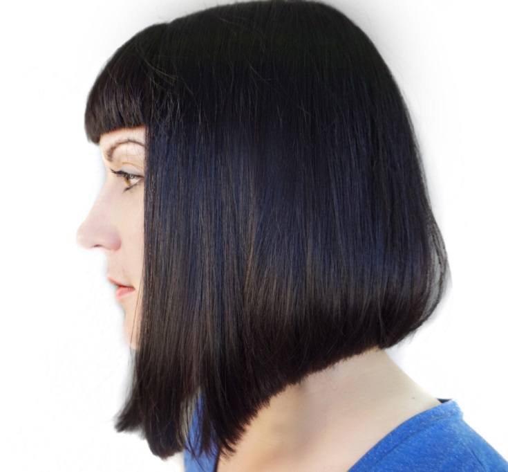 shot of woman with medium a line with bangs in a salon posing