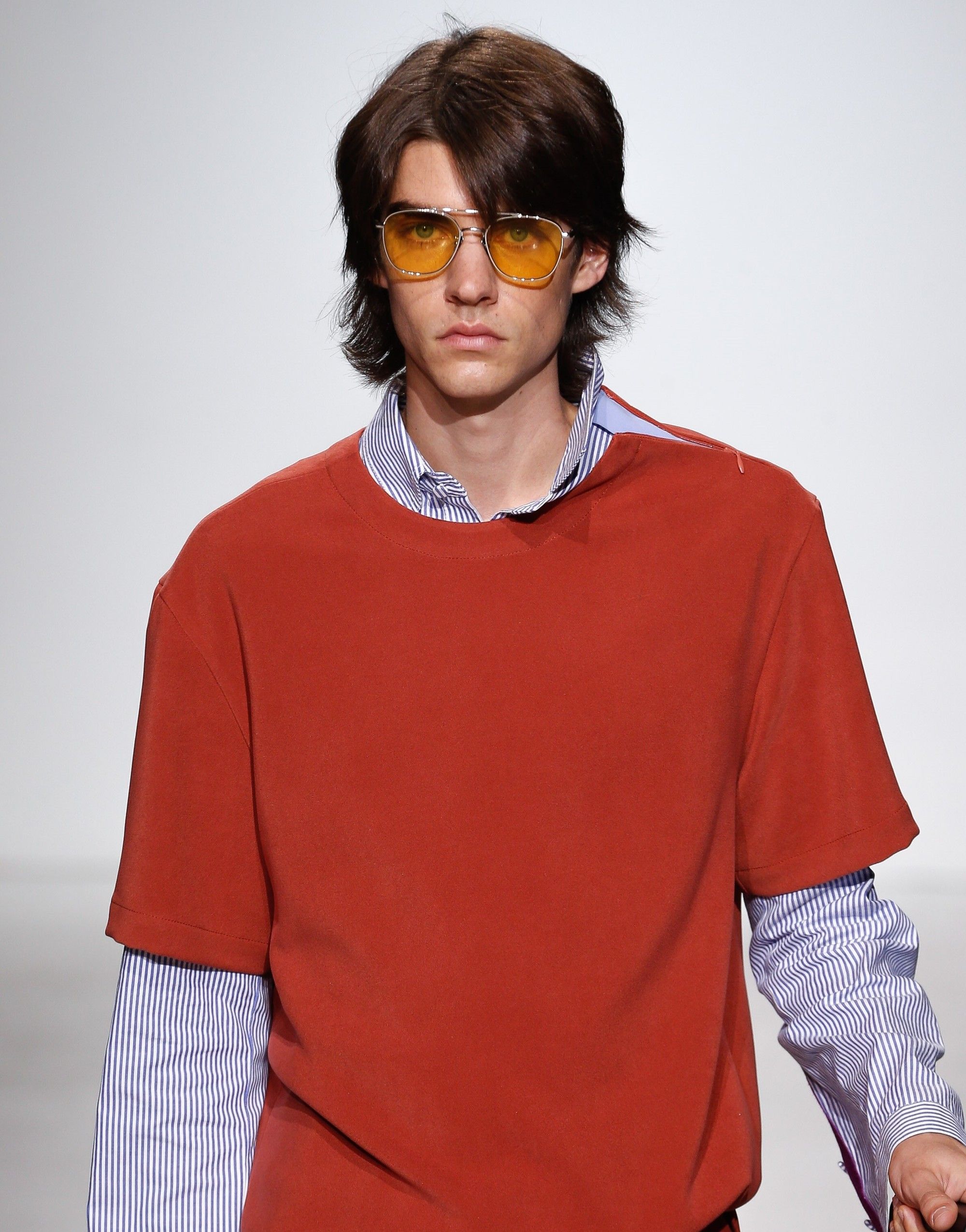 brunette male model with a 70s shag haircut