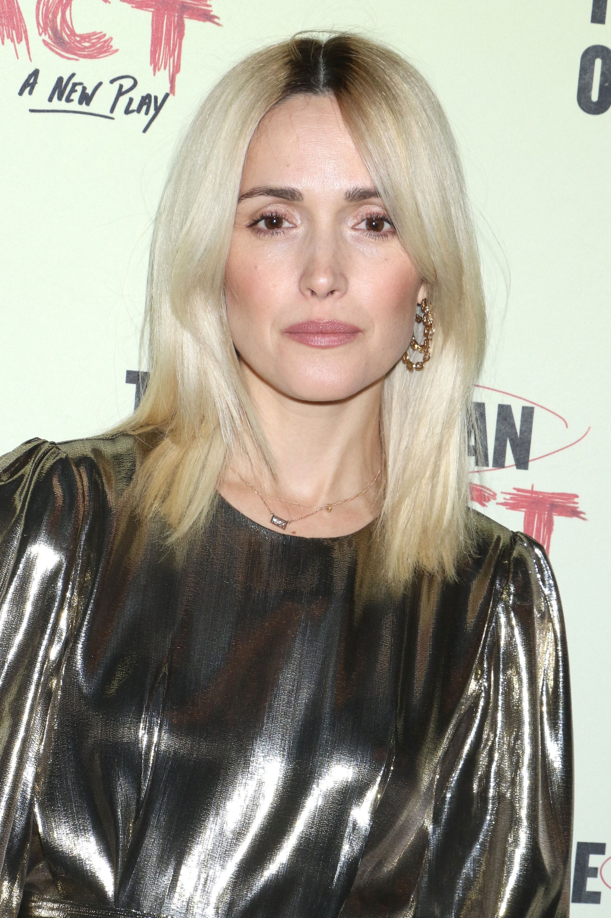Fall hair colours: Rose Byrne shoulder length bleach blonde hair with dark roots wearing a metallic dress.