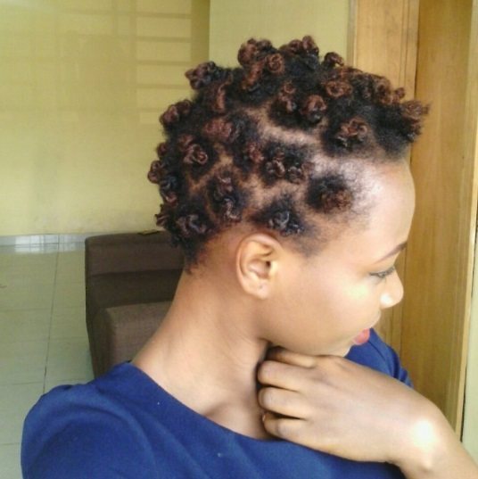 side profile of a woman with short bantu knots