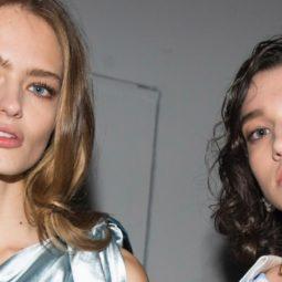 what is hair mousse: shot of two models with voluminous hair, backstage posing