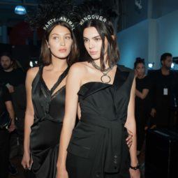 party bob hair trend: close up shot of two models with party hair bobs, wearing black and jewellery