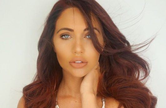 close up shot of amy childs with red hair posing on instagram