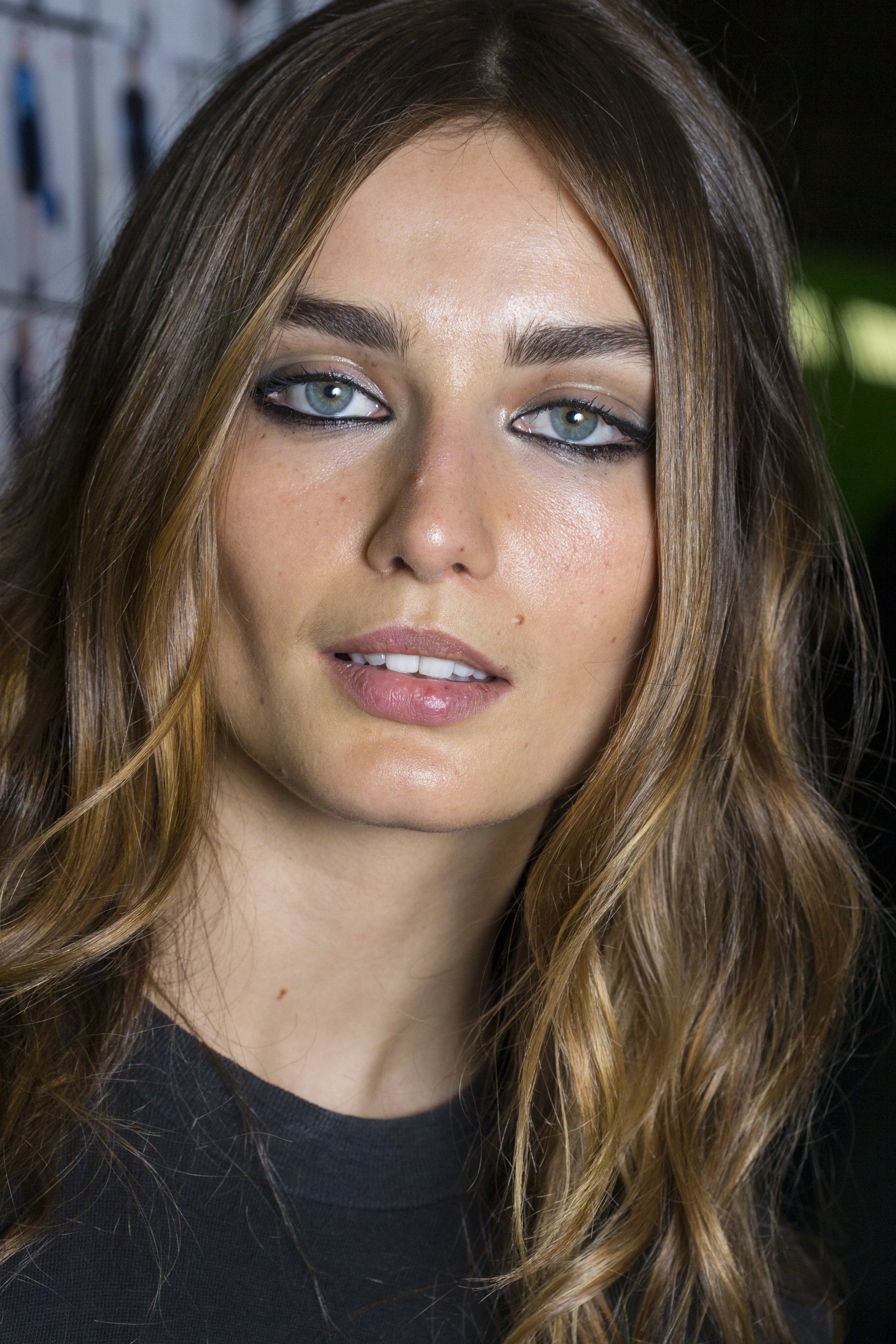 front view of brown hair model with soft balayage