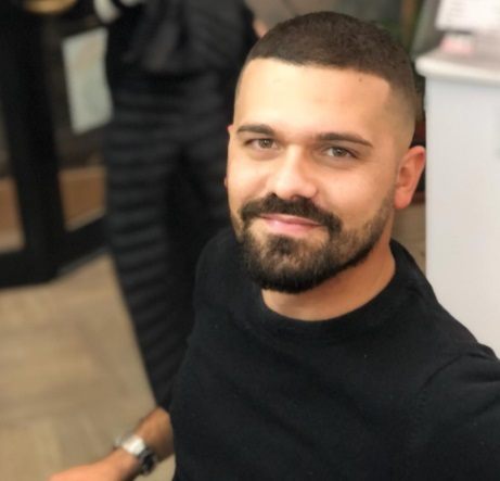 photo of a man with a short buzz cut haircut