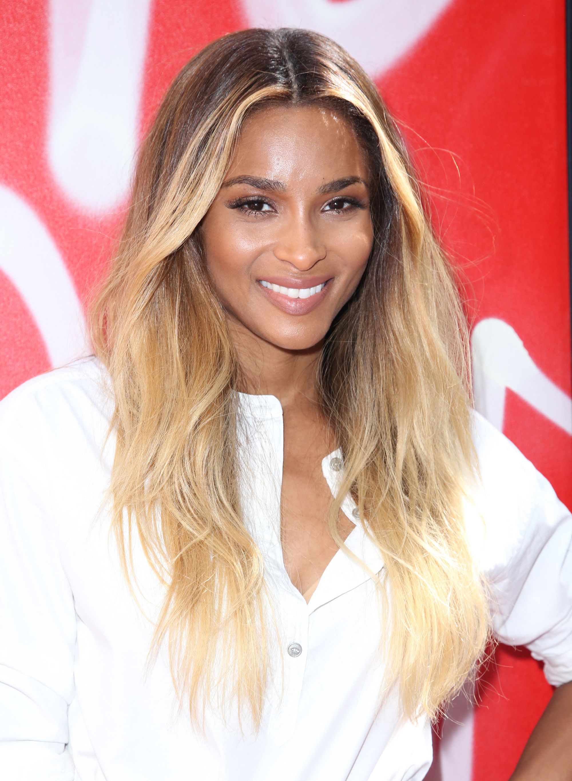 Blonde hair: Close up shot of Ciara with caramel blonde wavy hair.