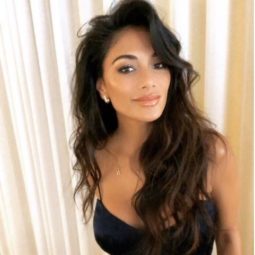 front view of nicole scherzinger with long dark hair with voluminous waves