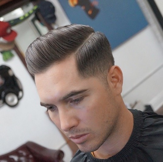 brunette man with a pompadour hairstyle