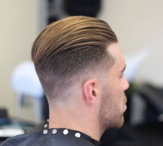 view from behind of a man with slicked back hair