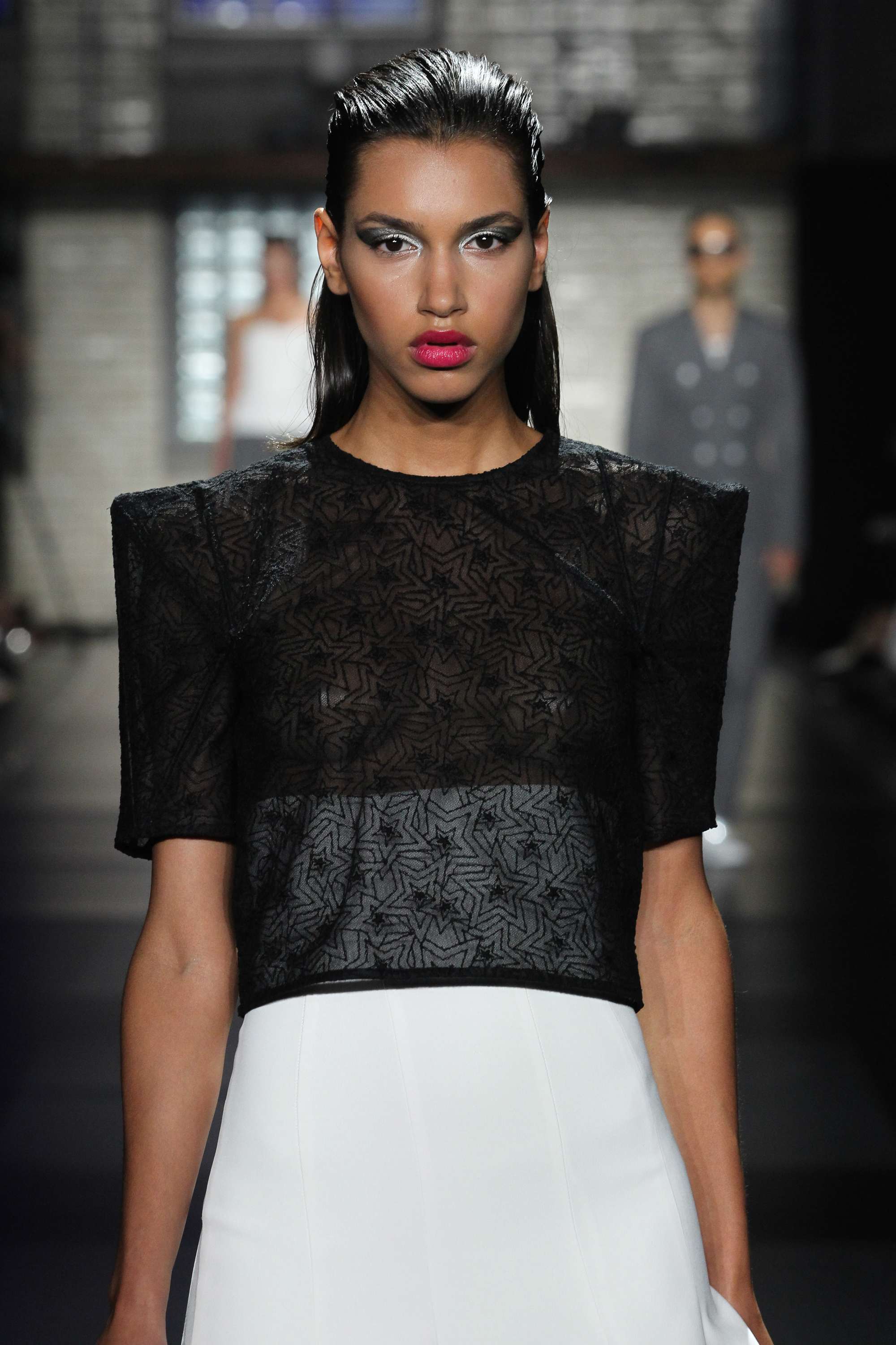 Ideas for crazy hair day: Runway model with dark brunette wet look slicked back hair