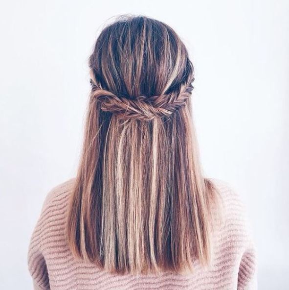 back view of brown and blonde highlighted hair in half,up fishtail braid