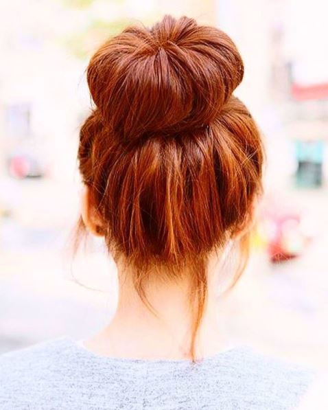 back view of ginger hair in high messy donut bun