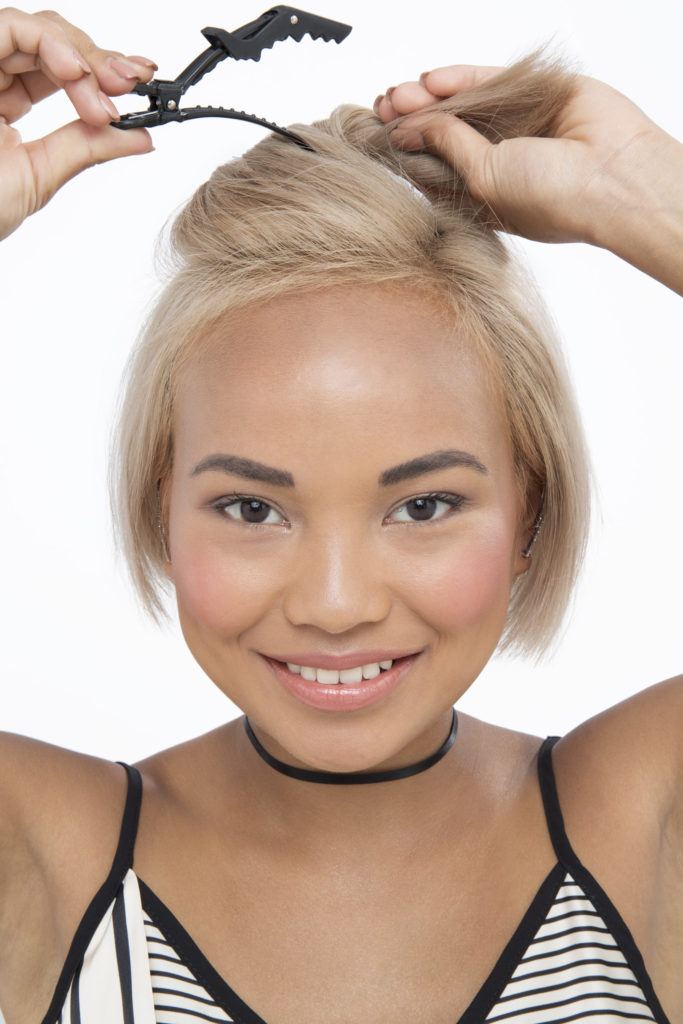 How to curl short hair blonde girl looking at camera with hair clip