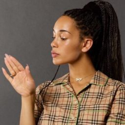 side view of Jorja Smith with dark box braids in high ponytail