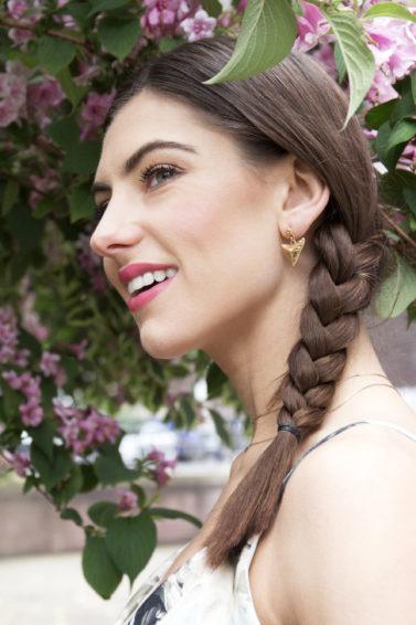 Side view of brunette model with side braid