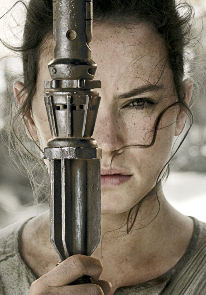 close-up of light saber and Daisy Ridley AKA Rey from Star Wars - The Force Awakens - 2015