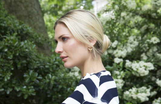 Blonde with a sleek, romantic low bun updo hairstyle